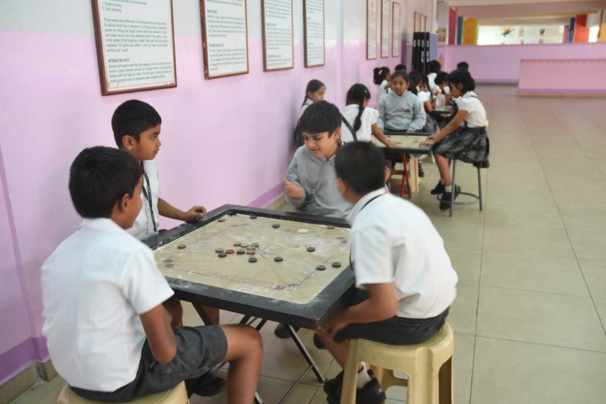 New Horizon Gurukul Students Playing Carrom