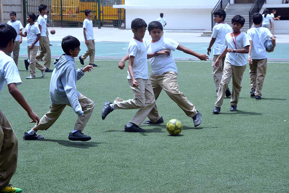 New Horizon Gurukul Students enjoying Football at play ground